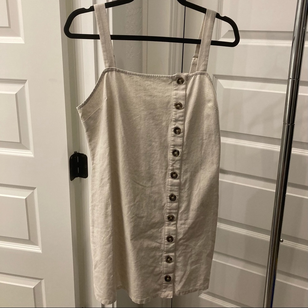 cream dress with zipper by sky and sparrow